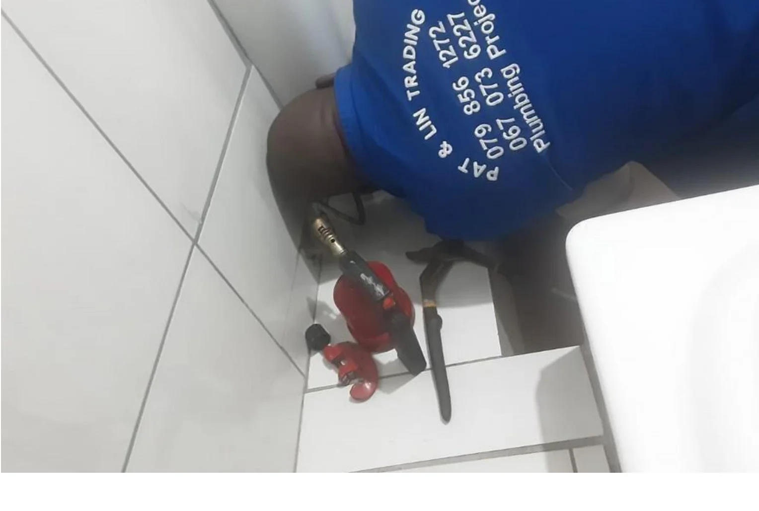 Pat & Lin Plumbing on-site vehicle and pipe fittings